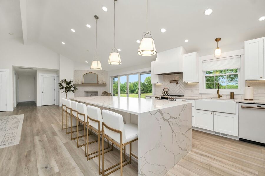 Modern remodeled kitchen with marble island