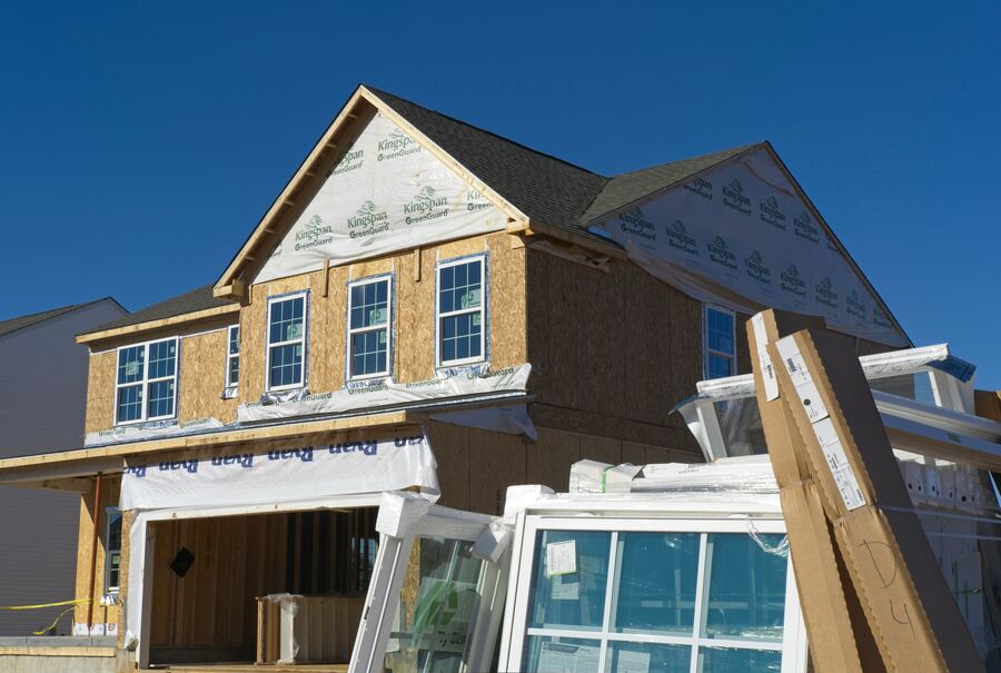 House under construction with open roof framing